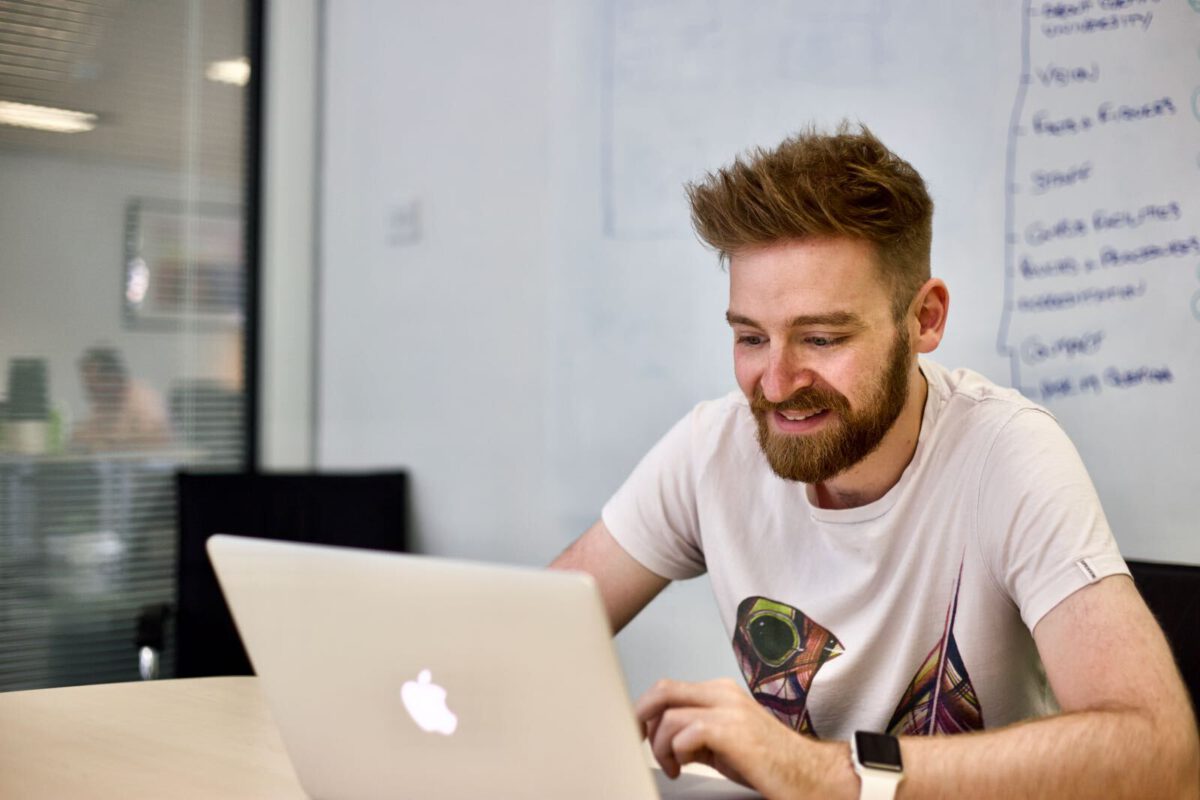 Dan works at his laptop