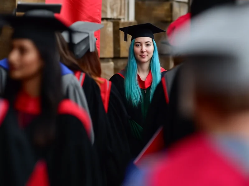 Graduate seen through a crowd of people