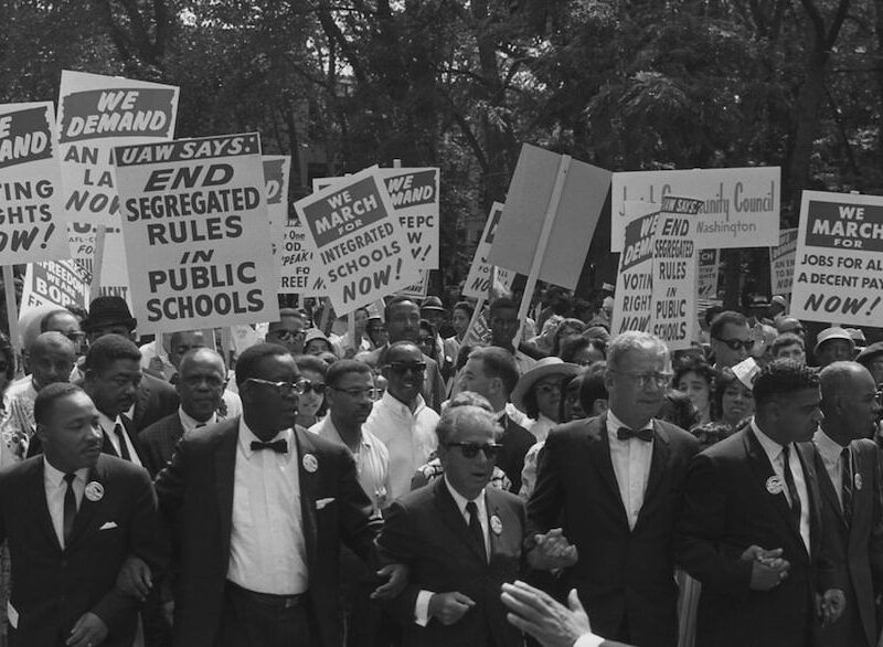 old photo of civil rights protesters with placards
