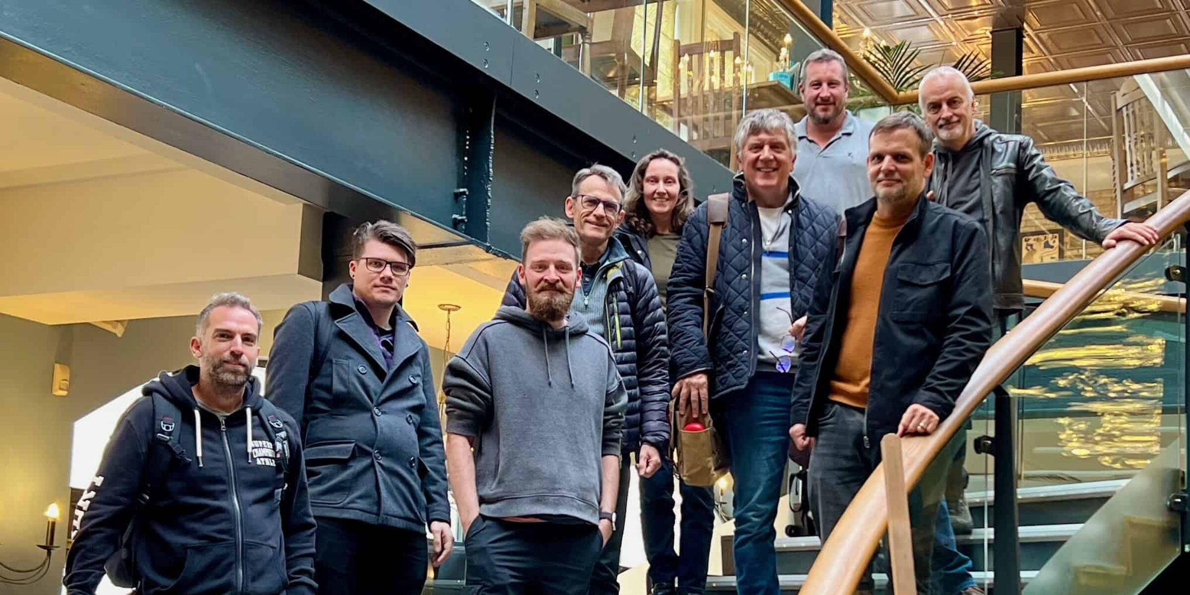 The headscape agency team standing on stairs